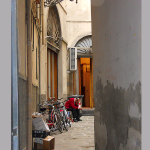 Photograph of man in alley in Florence Italy by Illustration Alley in Naples Florida.